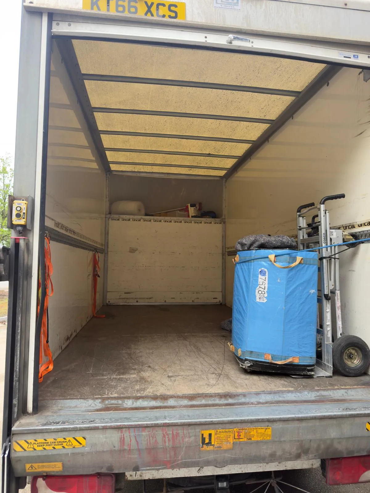 Luton box van being loaded on a terraced street