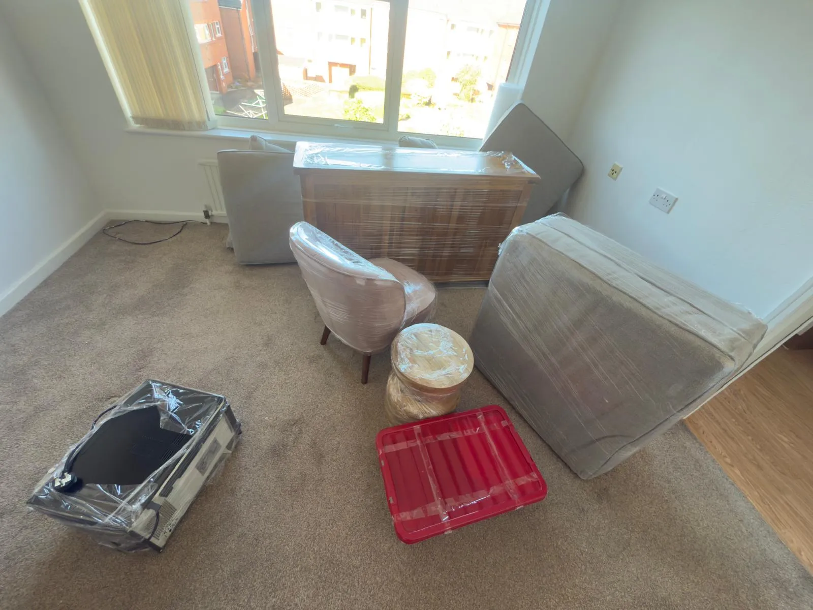 Stacked cardboard boxes and packing paper ready for a move